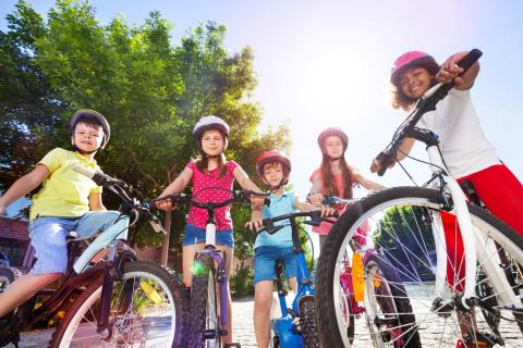 Happy children with their bicycles. 